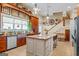 Spacious kitchen with a large center island, stainless steel appliances, and stylish decor elements at 2173 Conyers Se St, Covington, GA 30014