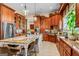 Bright, open kitchen with granite counters, stainless appliances, a large island, and custom cabinetry at 2173 Conyers Se St, Covington, GA 30014