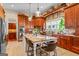 Gourmet kitchen featuring a large island, granite countertops, custom cabinets, and modern appliances at 2173 Conyers Se St, Covington, GA 30014