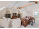 Spacious living room features recessed lighting, beamed ceilings, comfortable seating, and stylish decor at 2173 Conyers Se St, Covington, GA 30014
