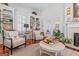 Inviting living room with custom built-ins, fireplace, and seating area at 2173 Conyers Se St, Covington, GA 30014