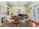 Home office with built-in bookshelves, desk, and natural light at 2173 Conyers Se St, Covington, GA 30014