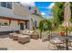 Charming patio with outdoor seating and dining areas surrounded by lush landscaping, perfect for entertaining at 2173 Conyers Se St, Covington, GA 30014