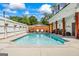 Sparkling pool with a swing chairs and patio seating, perfect for summer relaxation and entertaining at 2173 Conyers Se St, Covington, GA 30014