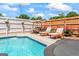 Pool with clear water and lounge chairs, ideal for relaxation and enjoying the outdoors at 2173 Conyers Se St, Covington, GA 30014