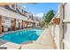A full-length swimming pool is surrounded by a concrete patio and a white fence at 2173 Conyers Se St, Covington, GA 30014