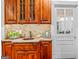 Elegant wet bar area with granite countertop and rich wood cabinetry, perfect for entertaining at 2173 Conyers Se St, Covington, GA 30014