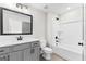 Bathroom featuring a gray vanity, toilet, shower and tub combo at 279 Deer Creek Run # 4, Moreland, GA 30259