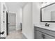 Powder room has tile flooring, quartz countertop vanity and a modern mirror at 279 Deer Creek Run # 4, Moreland, GA 30259