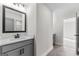 Bright bathroom features a framed mirror over the vanity with drawers for ample storage at 279 Deer Creek Run # 4, Moreland, GA 30259
