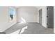 This spare bedroom features neutral paint, soft carpet flooring and a large closet at 279 Deer Creek Run # 4, Moreland, GA 30259
