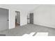 Spare bedroom with soft carpet, neutral paint and two doorways at 279 Deer Creek Run # 4, Moreland, GA 30259