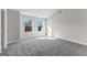 Bright bedroom featuring neutral walls, carpet flooring, and two windows offering natural light at 279 Deer Creek Run # 4, Moreland, GA 30259