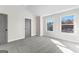 Spacious bedroom featuring a gray door, carpet flooring, and two windows offering natural light at 279 Deer Creek Run # 4, Moreland, GA 30259