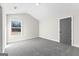 Bedroom featuring neutral walls, carpet flooring, and one window offering natural light at 279 Deer Creek Run # 4, Moreland, GA 30259