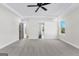 Bright bedroom featuring new carpet, a ceiling fan, and large windows at 279 Deer Creek Run # 4, Moreland, GA 30259
