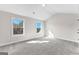 Secondary bedroom features large windows, plush carpet and neutral paint at 279 Deer Creek Run # 4, Moreland, GA 30259