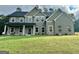 Charming two-story home with a manicured lawn and stylish gray siding at 279 Deer Creek Run # 4, Moreland, GA 30259