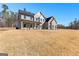 Beautiful two-story home with gray siding and a spacious yard, perfect for outdoor activities and relaxation at 279 Deer Creek Run # 4, Moreland, GA 30259