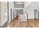 Grand foyer featuring hardwood floors, a staircase, and an open design with natural light flowing throughout at 279 Deer Creek Run # 4, Moreland, GA 30259