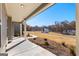 Inviting covered front porch with elegant columns and a view of the landscaped front yard and neighboring homes at 279 Deer Creek Run # 4, Moreland, GA 30259