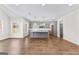 Bright, open kitchen area with modern gray cabinets, a center island, and hardwood flooring at 279 Deer Creek Run # 4, Moreland, GA 30259