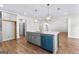Modern kitchen featuring a gray island with bar seating, open to the living area for seamless entertaining at 279 Deer Creek Run # 4, Moreland, GA 30259