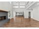 Open-concept living room showcasing a gray fireplace and seamless flow into the kitchen, promoting modern living at 279 Deer Creek Run # 4, Moreland, GA 30259