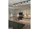 Well-lit kitchen features granite counters, stainless appliances, tile backsplash, a large island and custom cabinets at 1081 Bridge Mill Ave, Canton, GA 30114