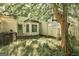 Backyard featuring a grassy lawn, wooden fence, patio, and foliage at 5599 Fair Creek Way, Lithonia, GA 30038