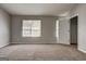 Bedroom features neutral walls, carpet, a window and closet at 5599 Fair Creek Way, Lithonia, GA 30038