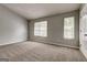 Neutral bedroom with neutral walls, carpet, windows and natural light at 5599 Fair Creek Way, Lithonia, GA 30038
