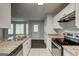 Kitchen features granite countertops, stainless steel appliances, and lots of natural light at 5599 Fair Creek Way, Lithonia, GA 30038