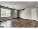 Spacious living room featuring hardwood floors and natural lighting at 5599 Fair Creek Way, Lithonia, GA 30038