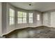 Living room with wood floors, neutral walls, lots of windows and natural light at 5599 Fair Creek Way, Lithonia, GA 30038