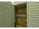 A narrow storage space with concrete floors and walls is viewed from the doorway at 5599 Fair Creek Way, Lithonia, GA 30038