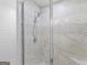 This bathroom features a tiled shower with glass door and neutral accents at 1190 N Ola Rd, Mcdonough, GA 30252