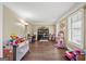 Versatile bonus room with hardwood floors, ample natural light, and plenty of space for activities at 4435 Ross Estates Ct, Snellville, GA 30039