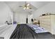 Cozy bedroom with a ceiling fan, neutral color scheme, and a spacious closet at 4435 Ross Estates Ct, Snellville, GA 30039