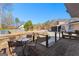 Spacious backyard deck with seating, offering views of the well-maintained lawn and mature trees at 90 Hazelridge Ln, Sharpsburg, GA 30277