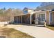 Outdoor patio featuring a built-in grill, seating area, screened-in porch, and a well-maintained yard at 90 Hazelridge Ln, Sharpsburg, GA 30277