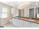 Elegant bathroom featuring double sinks, granite counters, and a tiled shower at 90 Hazelridge Ln, Sharpsburg, GA 30277