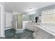 Bright bathroom featuring a separate shower, soaking tub, vanity, and tiled floor at 90 Hazelridge Ln, Sharpsburg, GA 30277