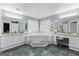 A luxurious bathroom with a vanity, a jacuzzi tub, and a separate makeup area at 90 Hazelridge Ln, Sharpsburg, GA 30277