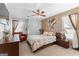 Cozy bedroom features neutral decor, a comfortable bed, and soft natural light at 90 Hazelridge Ln, Sharpsburg, GA 30277