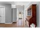Spacious foyer featuring tile flooring, a decorative cabinet, and a view of the front entrance at 90 Hazelridge Ln, Sharpsburg, GA 30277