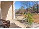 View of covered entryway with tiled flooring, quaint decor, and outdoor landscaping at 90 Hazelridge Ln, Sharpsburg, GA 30277