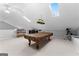 Bright game room with skylights, pool table, ceiling fan and neutral carpet at 90 Hazelridge Ln, Sharpsburg, GA 30277