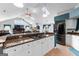 Open floor plan showcasing granite counters, white cabinets, stainless steel appliances, and skylights at 90 Hazelridge Ln, Sharpsburg, GA 30277