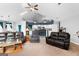 Spacious living room featuring comfortable seating and an open floor plan to kitchen at 90 Hazelridge Ln, Sharpsburg, GA 30277